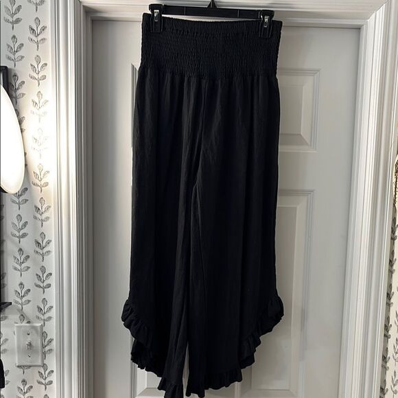 Black Ruffle Hem Wide-Leg Gaucho Pants.  Elastic waist and ruffle hemline - Picture 1 of 11